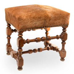 Carved Footstool. Newly Upholstered in a Cowhide.