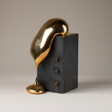 Handmade Ceramic Sculpture in Burnished Gold on Steel Pedestal with Metal Rivets, Titled: The Drip