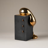 Handmade Ceramic Sculpture in Burnished Gold on Steel Pedestal with Metal Rivets, Titled: The Drip
