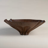 Vintage brutalist copper bowl with fluted design and aged patina.